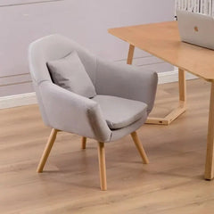 Ergonomic Nordic padded chair with thick cushion, backrest, and wooden legs.